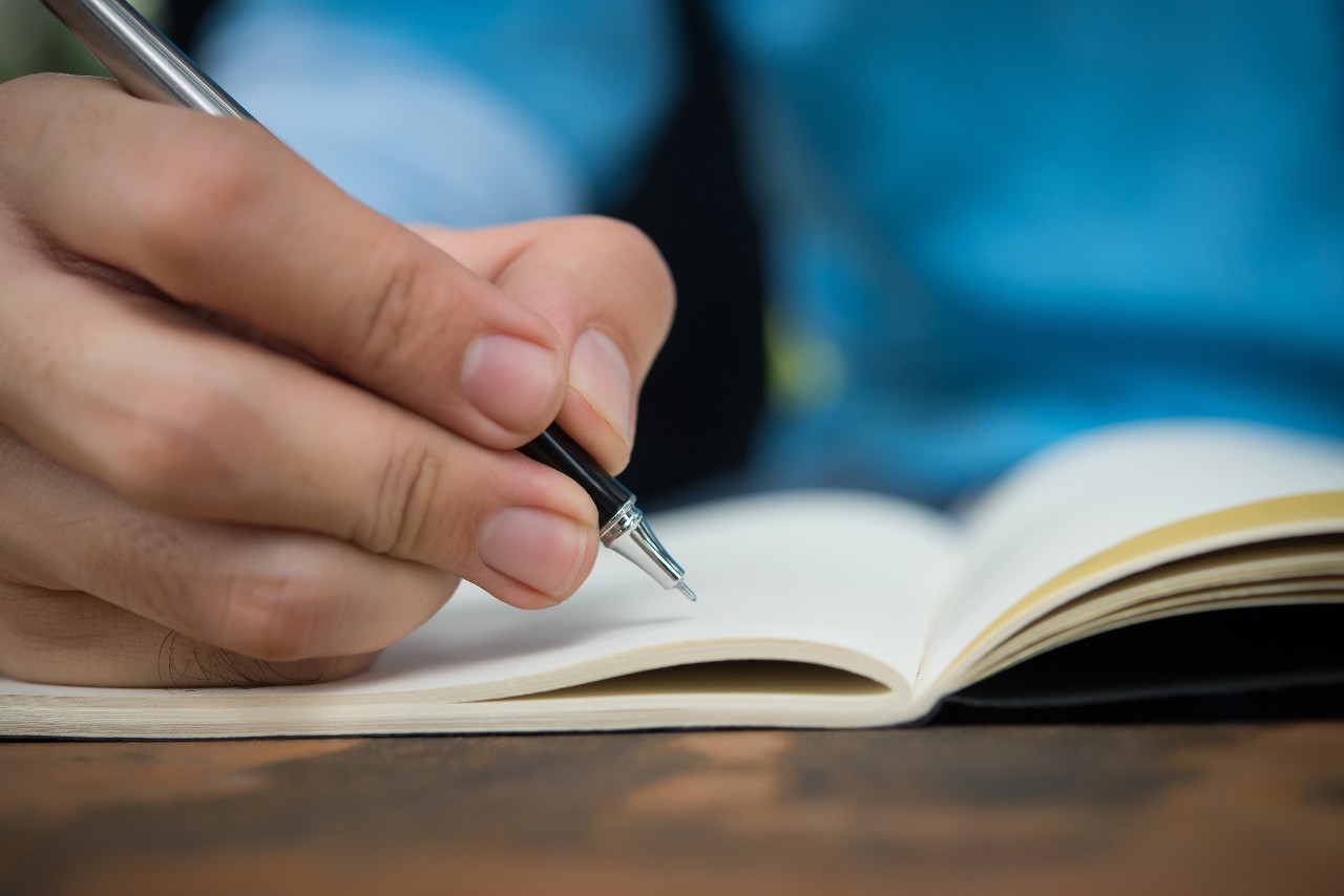 man-hand-write-on-the-notebook